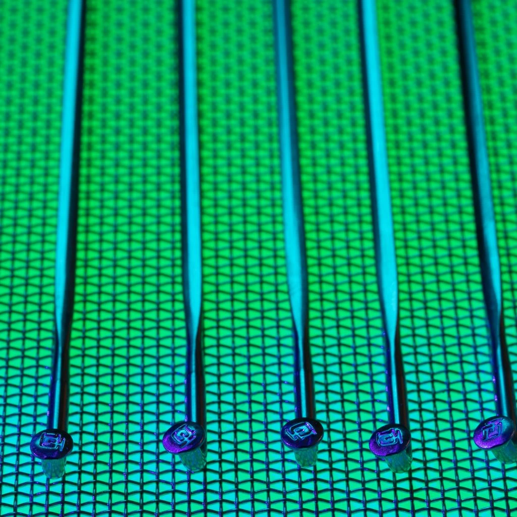 Inside a semiconductor fab as technicians inspect a silicon wafer.